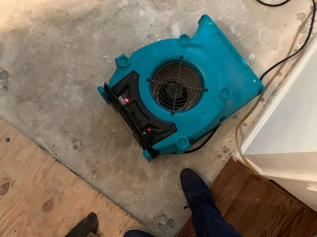 Air mover drying subfloor during Leak Detection & Repair in Thornton